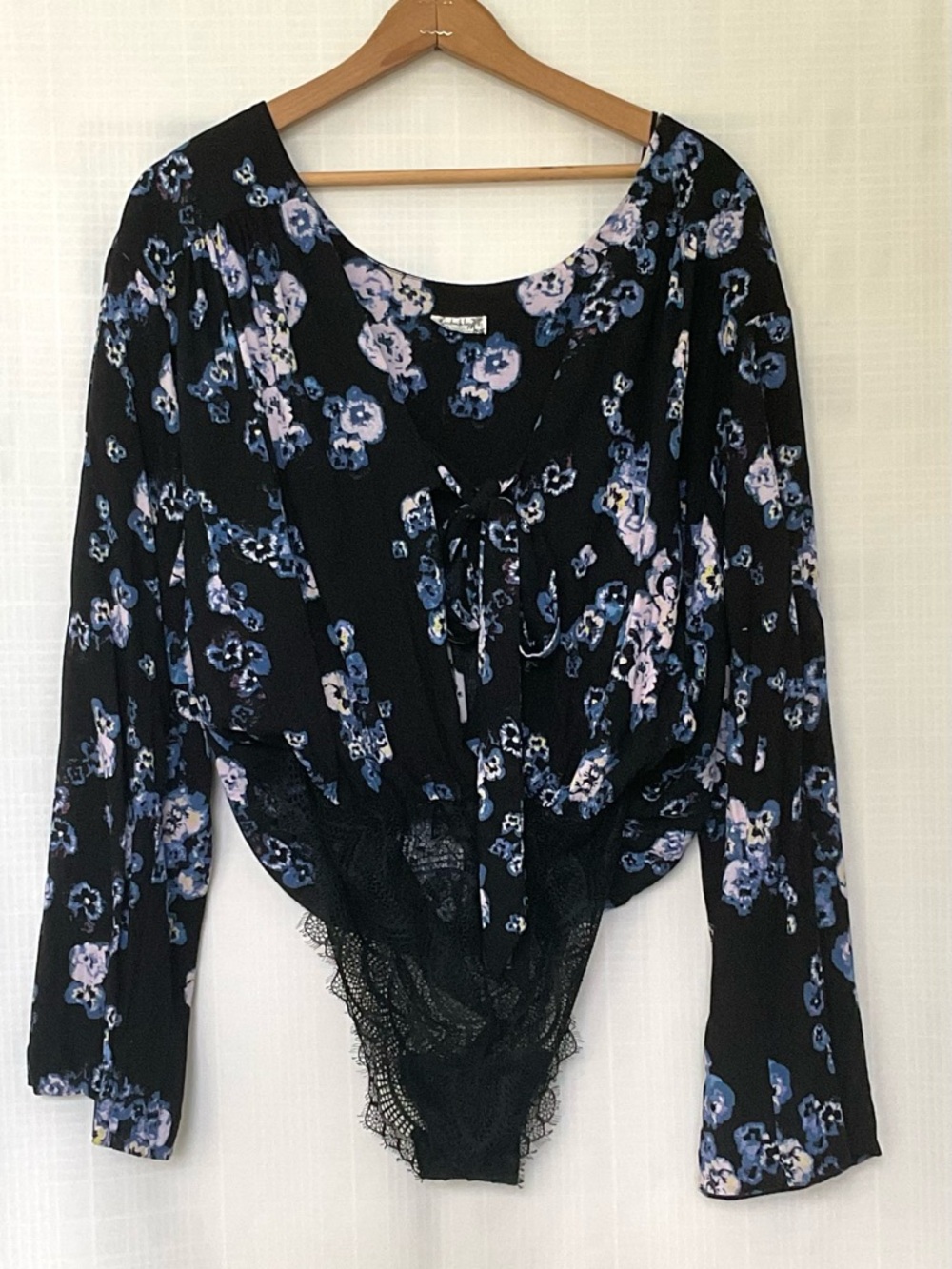 Free People black and purple floral bell sleeve bodysuit with front tie
